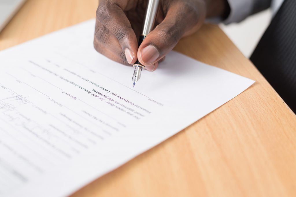 hand signing a document