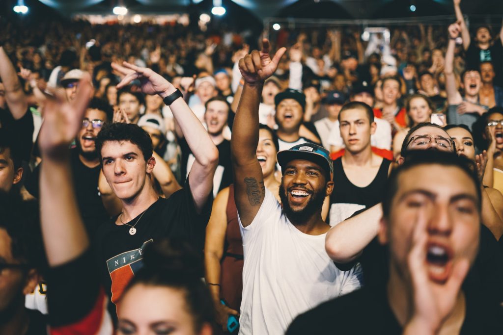 A crowd of excited people cheering